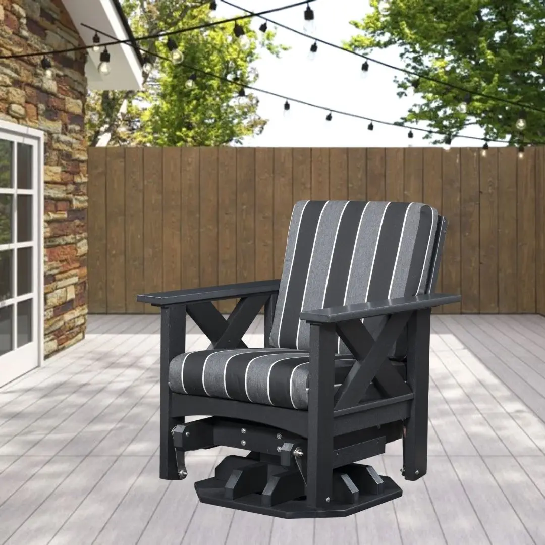 Dark gray outdoor swivel chair with striped cushions on a wooden deck under string lights.