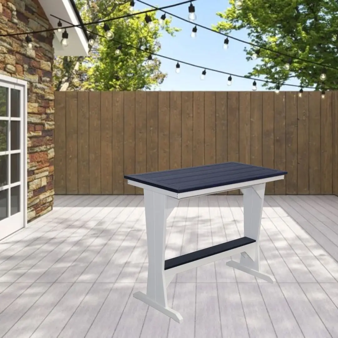 Outdoor white high table with a navy blue top on a light deck, string lights overhead and a wooden fence in the background.